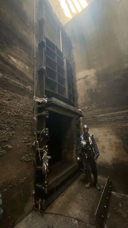 Crane lifting a 4.5 tonne penstock out of the deep chamber at Duncrue Street TPS Belfast