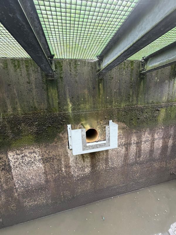 Stainless steel flow measuring plate mounted on GRP box, designed, manufactured and installed by Liberty Water