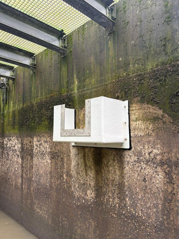 Side profile of GRP flow measuring weir box with stainless steel plate installation